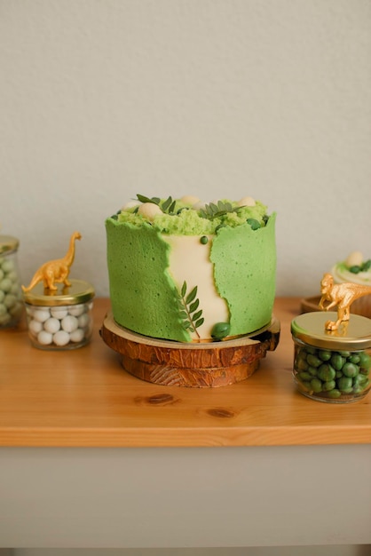 Cake decorated with decorative green moss for a children's holiday