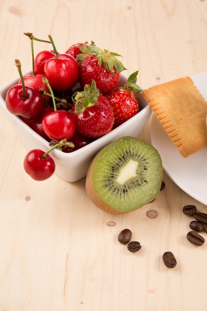 Cake and fruits on the wooden table