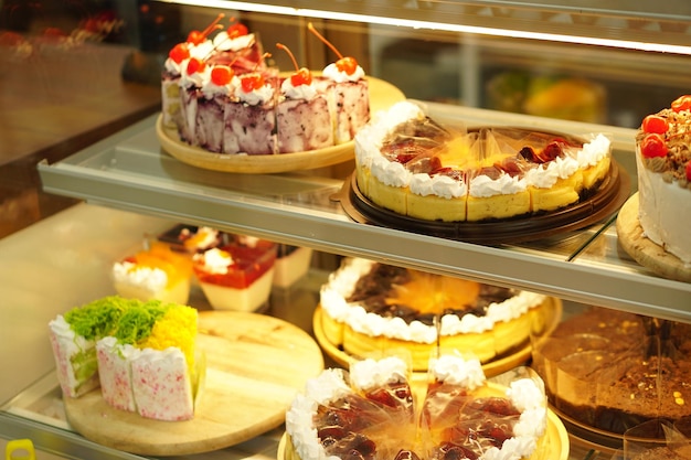 cake in glass cabinet cut into pieces Sold in a coffee shop