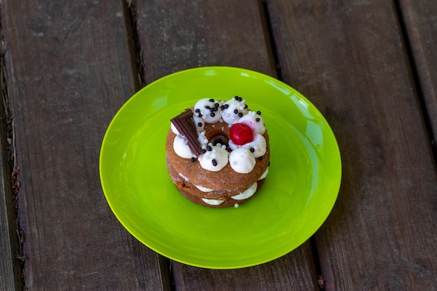 A cake or Honey cake closeup standing on a wooden table