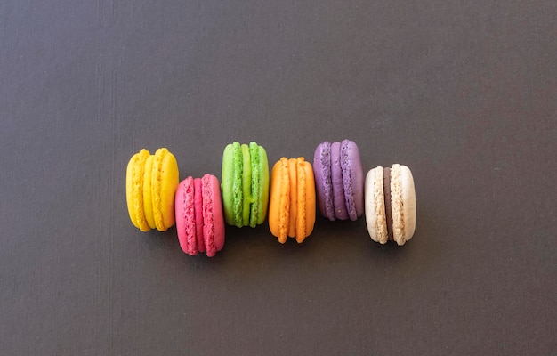 Cake macaron or macaroon on black background colorful macaroons Colorful macaron cakes