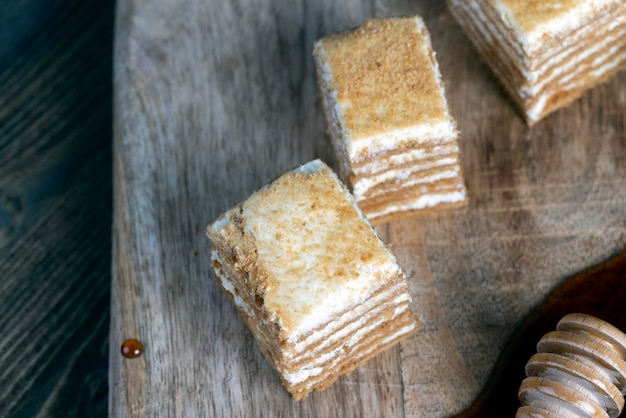 Cake made of thin honey cakes and a thin creamy layer