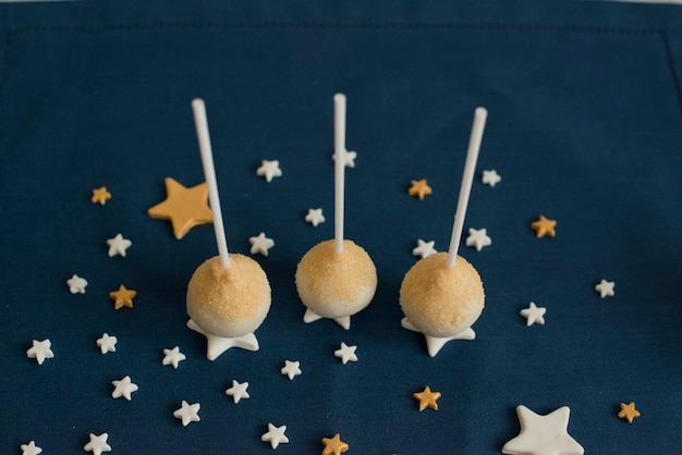 Cake pops sprinkled with golden crumbs