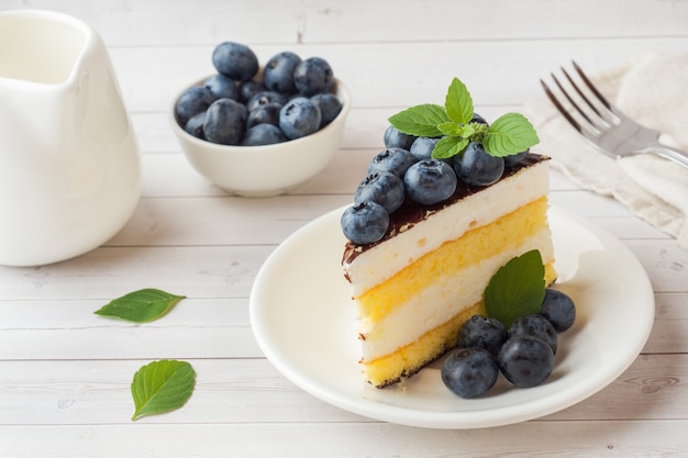 Cake of a souffle with glaze and fresh blueberries.