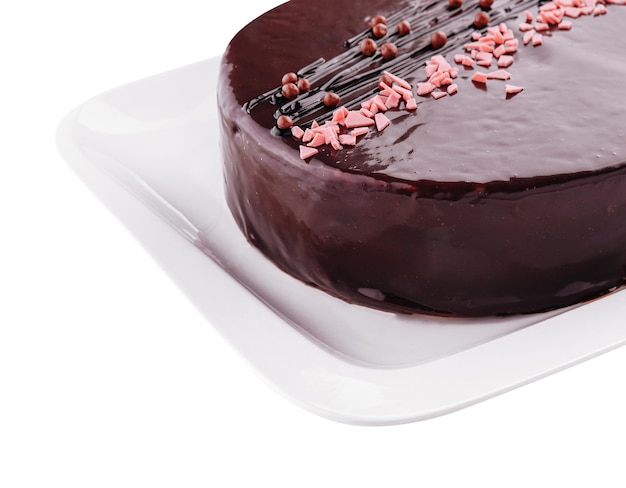 Photo cake on white plate with topping chocolate