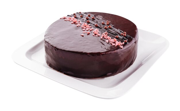 Cake on white plate with topping chocolate