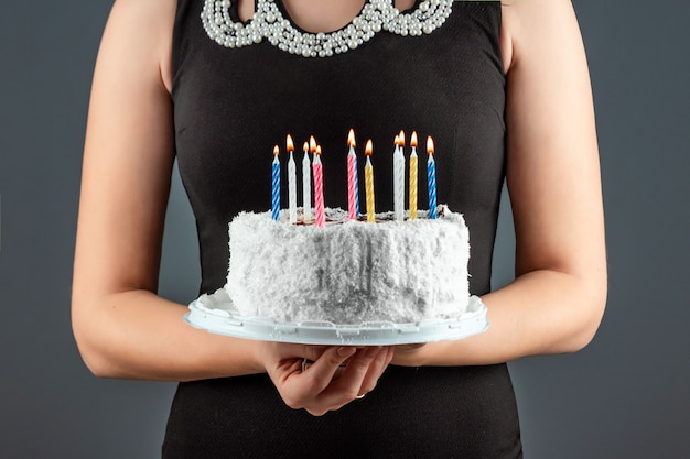 Cake with burning candles close-up. Happy birthday congratulation celebration party anniversary. Copy space.