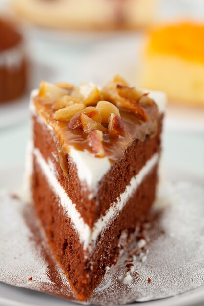 Cake with coffee cup in background