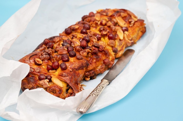 cake with dry fruits and canned sugar on white paper