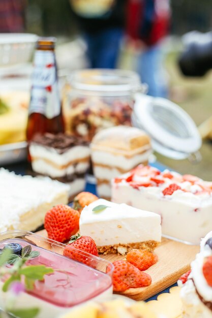 Photo cake with fruits on table