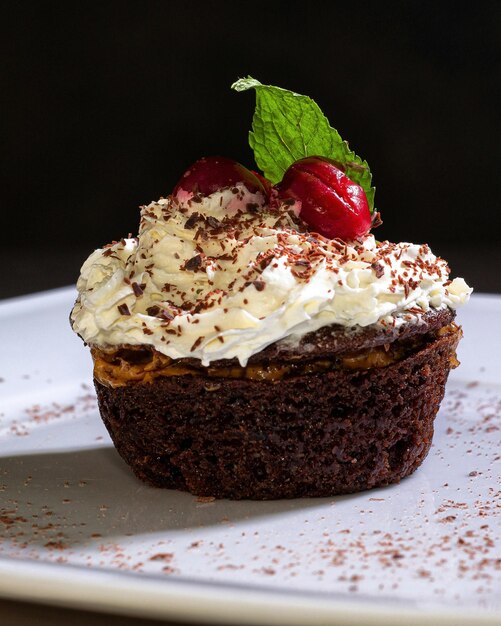 a cake with a green leaf on top of it