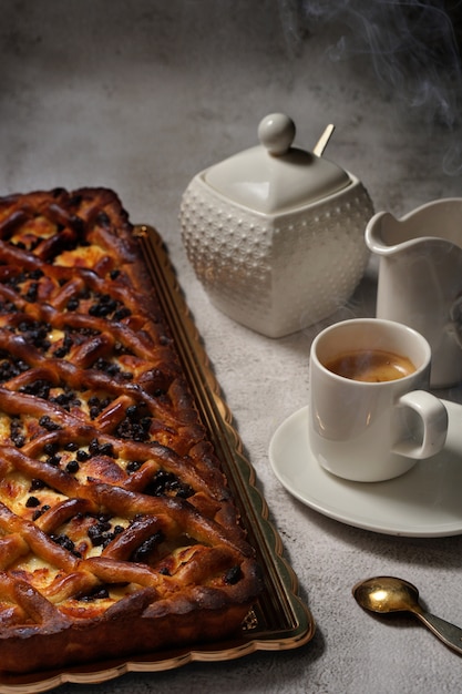 Cake with mug of coffee, view from above