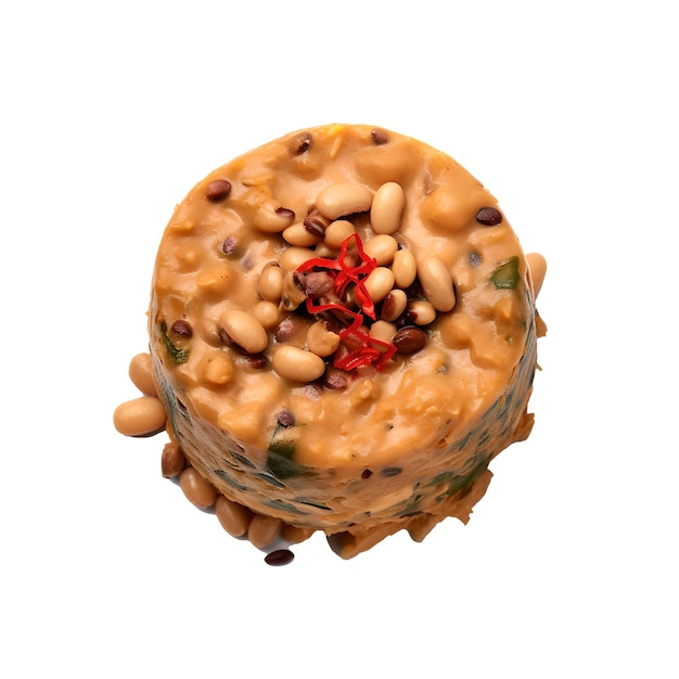 A cake with peanuts on it and a red chili on the top.