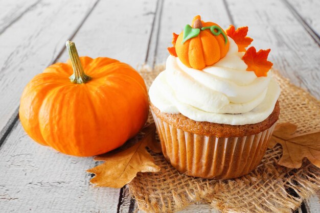 Cake with pumpkin ingredients and pumpkin decoration