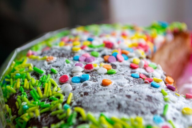 A cake with sprinkles on it is decorated with colorful sprinkles.