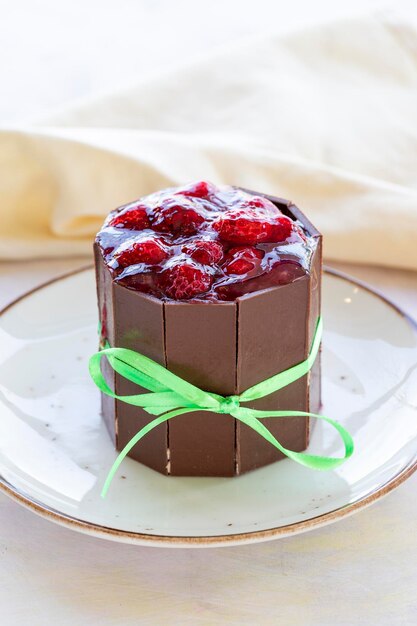 Photo cake with strawberries surrounded by chocolate milk