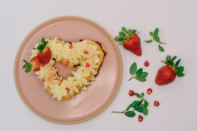 cake with Strawberry and vanilla cream. heart Biscuit