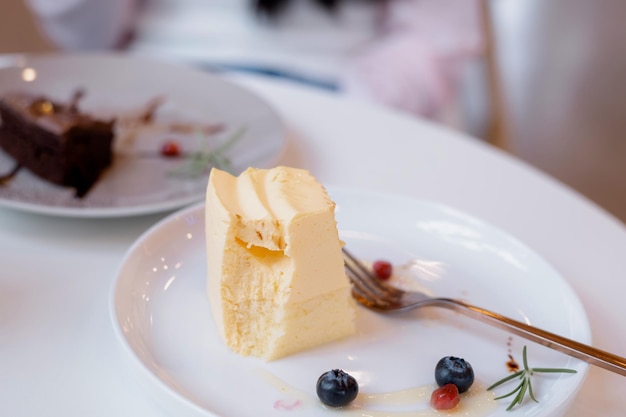 Cakes are placed on the table in the cafe