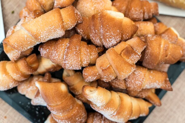 Cakes bagels Crispy croissants crescent Food on grey background