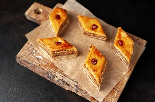 cakes on a cutting board on a stone background