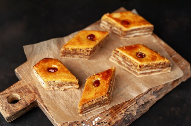 cakes on a cutting board on a stone background