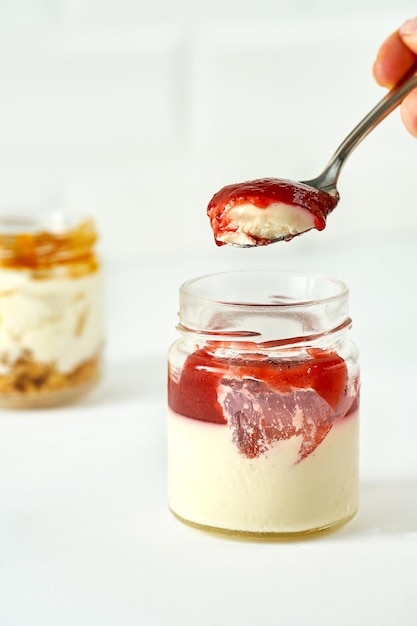 Cakes in jars on a white background Sweet desserts