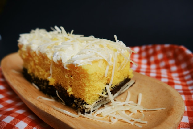 cakes with cheese on wooden plate