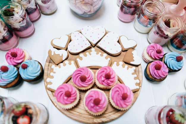 Cakes with raspberries and strawberry jam Dessert table for a wedding partyx9