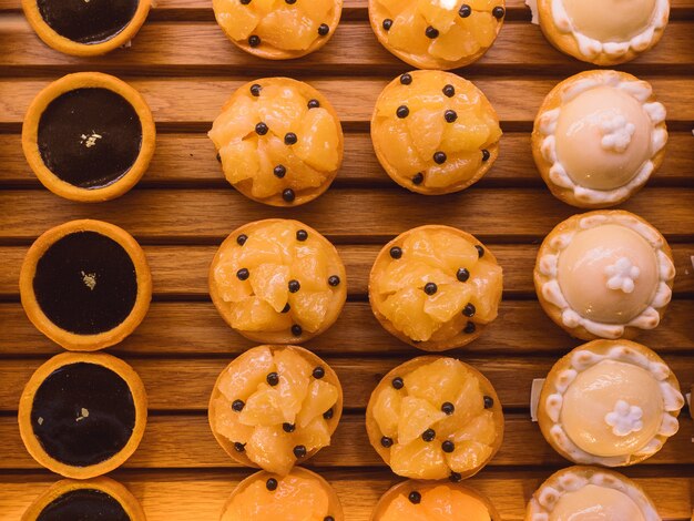 Cakes on wooden table. 