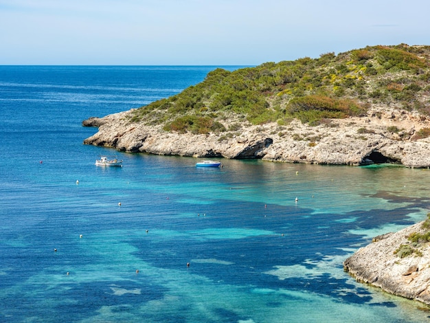 Cala Portinax bay with beautiful azure blue sea water