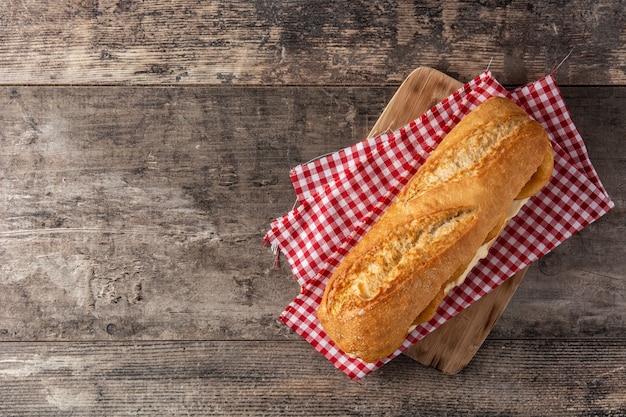 Calamari rings sandwich on wooden table, typical food from Madrid