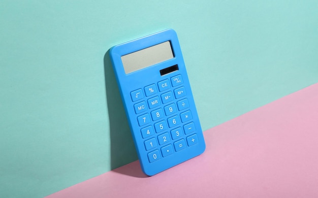 Calculator on bluepink background Minimalism Trendy shadow Creative layout