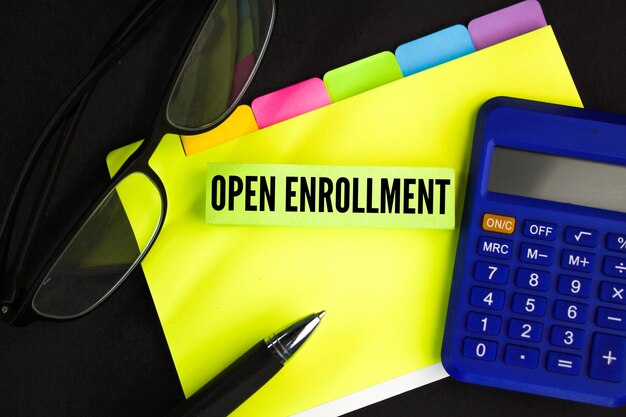 A calculator and a calculator with the word open enrollment on it