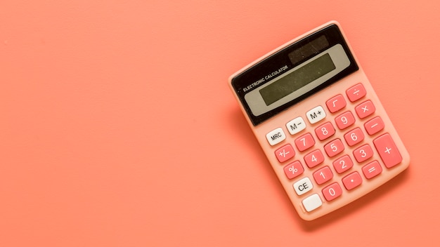 Calculator on colored surface