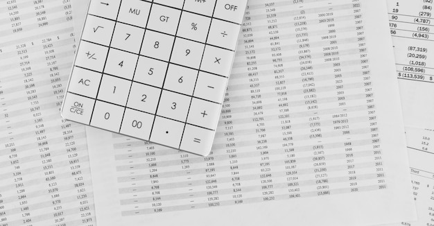 Calculator on financial statement Financial and business concept Top view