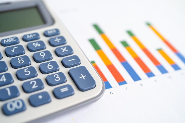 Calculator on graph paper. Finance development, Banking Account, Statistics, Investment Analytic research data economy, Stock exchange trading, Business company concept.