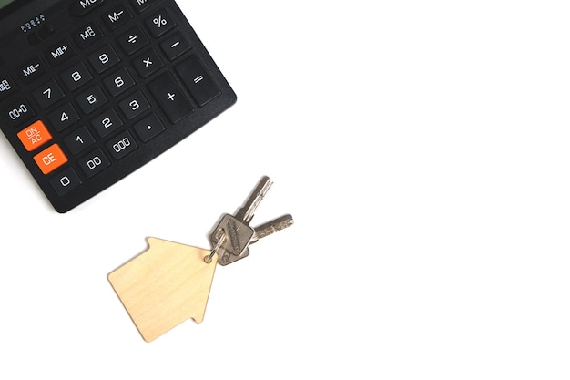 Calculator and house keys.Concept of buying and selling housing, mortgages and renting a house or apartment.