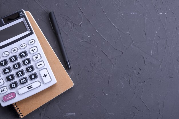 Calculator keypad on a table. Top view. Copy space