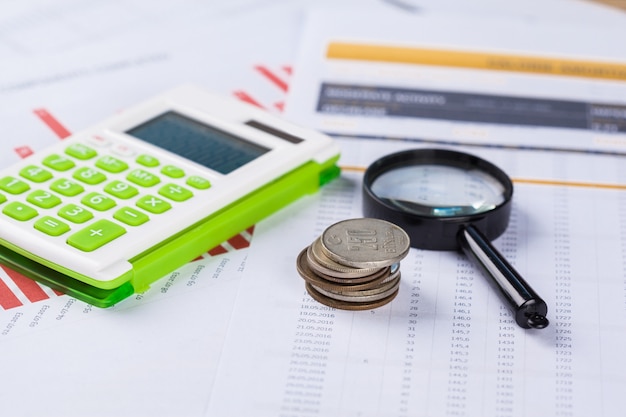 Calculator and magnifying glass on the table