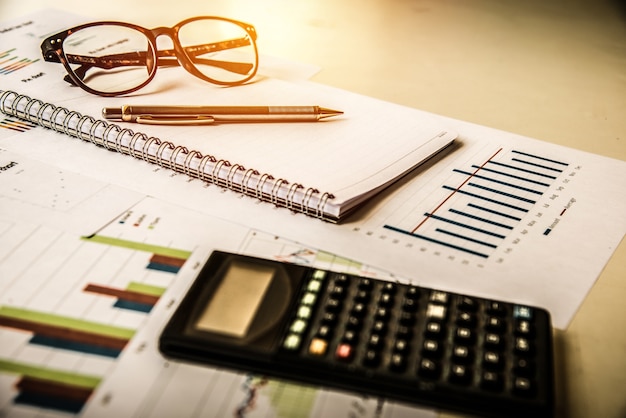 Photo calculator pen book financial graph and glasses