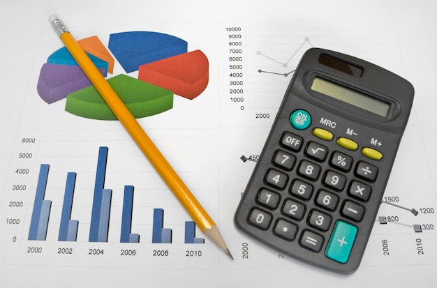 Premium Photo | Calculator and pen on a business background