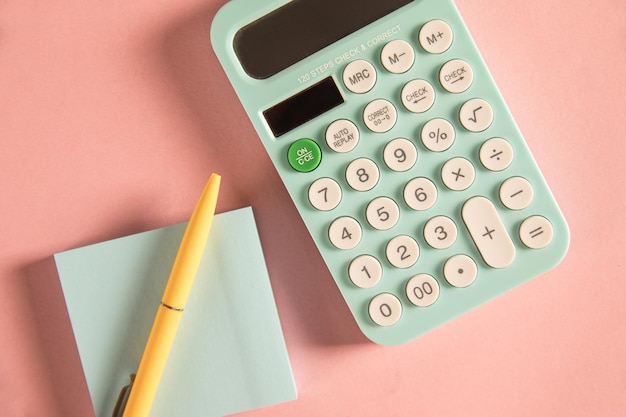 calculator pen and notepad