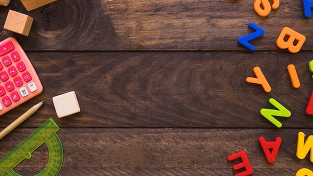 Calculator and stationery lying near letters