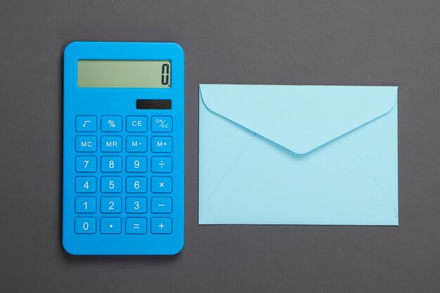 Calculator with envelope on gray