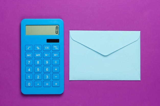 Calculator with an envelope on a purple