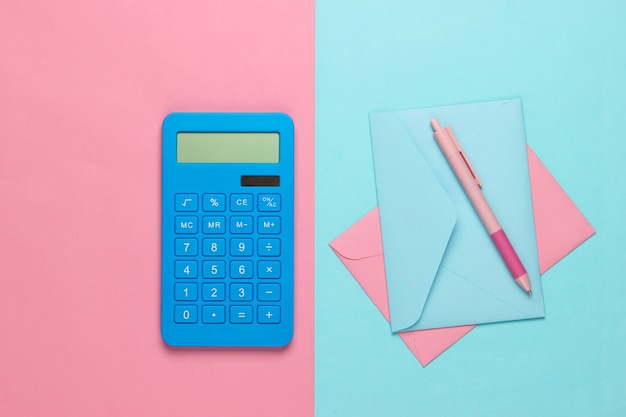 Calculator with an envelopes on pink blue pastel