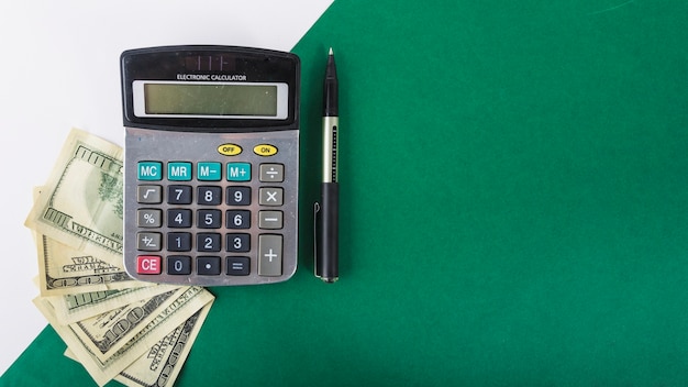 Photo calculator with paper money on table