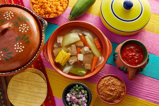 Caldo de res Mexican beef broth in table