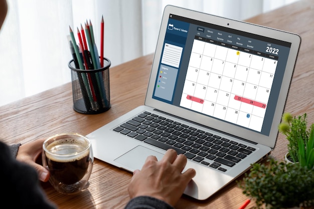 Photo calendar on computer software application for modish schedule planning for personal organizer and online business