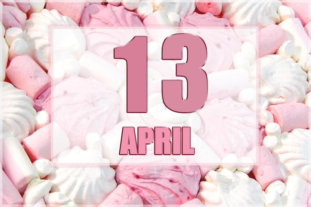 Calendar date on the background of white and pink marshmallows April 13 is the thirteenth day of the month